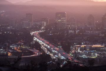 Predawn morning view of commuters on the 134 Ventura Freeway near Los Angeles in downtown Glendale,...