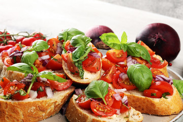 fresh tomato bruschetta. italian food appetizer with basil on table