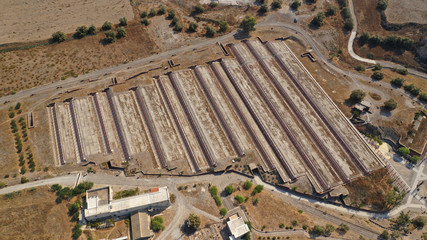 defaultAerial drone photo of iconic archaeological site of Akrotiri, Santorini island, Cyclades, Greece