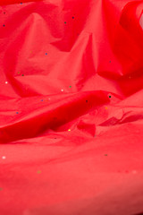 This is a photograph of a Red Confetti tissue paper background