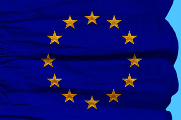 close-up photo of beautiful colored stylized European Union flag, symbol of united Europe on textured fabric, concept of tourism, emigration, economy and politics, close-up