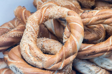 Obwarzanek krakowski sprinkled with sesame seeds.