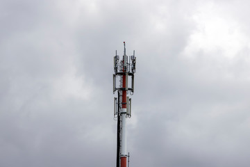 Mobile phone communication antenna tower with sky clouds, Telecommunication tower