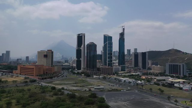 4K Aerial Drone video of San Pedro Skyscrapers in Monterrey Mexico. Landscape panoramic view with mountain Cerro de la Silla in background. 