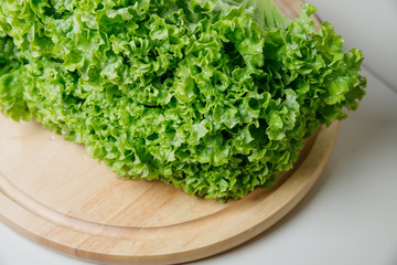 Fototapeta premium Fresh lettuce salad leaves bunch isolated on white background cutout