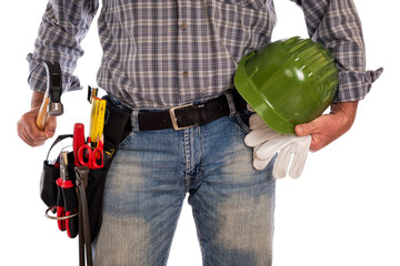 Craftsman carpenter adult isolated on white background, holding a carpenter’s hammer, helmet and leather work gloves. Work tools industry construction and do-it-yourself housework. Stock photography.