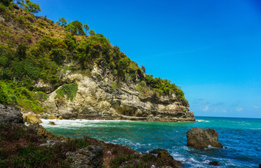 Fototapeta premium Resting place on the Bukit Sawangan to see the view of the Indian Ocean from above in Kebumen, Central Java, Indonesia