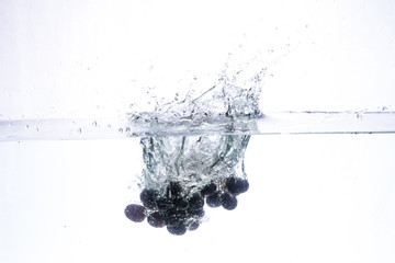 close-up of cherry in pure water with bubbles