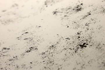 This is a photograph of a background created by applying Black marks onto a White paper using crayons