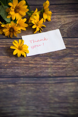 bouquet of beautiful blooming daisies on a wooden table