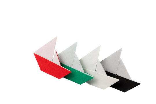 Paper boats arranged like UAE flag and  national day spirit of union - Powered by Adobe