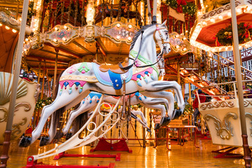 Fototapeta na wymiar Merry-go-round ride in amusement park