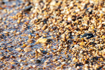 sea pebbles colored granite on the beach