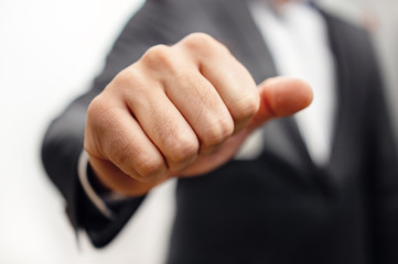 Businessman hand clenched fist - Tough Negotiations and aggressive Negotiator - Confrontation challenge Concept