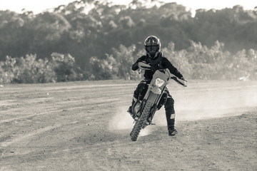 black and white image of an enduro rider