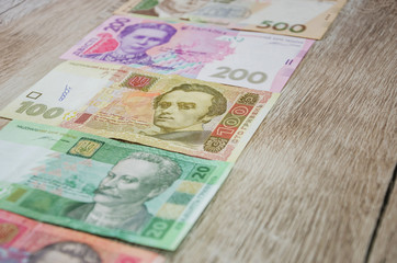 Ukrainian money on a wooden table
