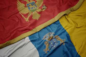 waving colorful flag of canary islands and national flag of montenegro.