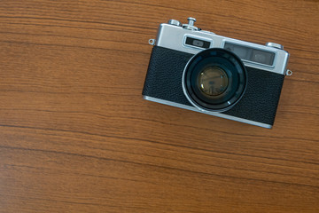 Antique Vintage Old Film Camera on Wooden background