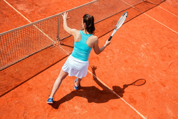 Female tennis player on the net