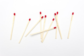 Scattered matches are isolated on a white background, long matches