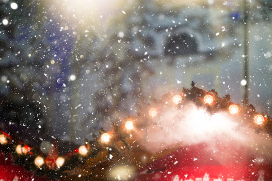 Defocused Christmas themed background with snowflakes. Christmas market theme. 