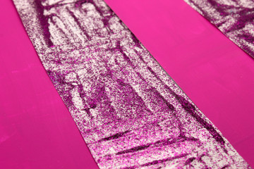 This is a photograph of an abstract background created by organizing stripes created using Purple glitter paint and Fuschia Pink acrylic paint