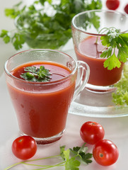 Fresh vitamin tomato juice for breakfast with parsley leaves