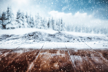 White snowy winter background with space for your products and decoration. Blurred landscape of mountains. Christmas time.