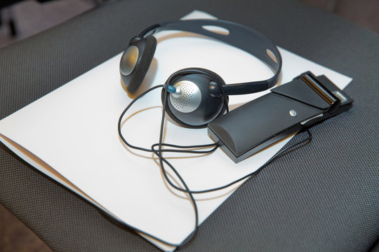 headphones used for simultaneous translation equipment simultaneous interpretation equipment . A set of headphones for simultaneous translation during negotiations in foreign languages.