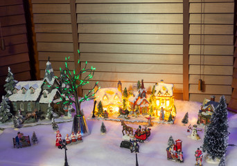 Christmas village window display with lighting