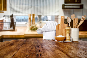 Kitchen table top with empty space for you products or decoration and blurred kitchen furniture background.