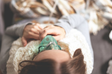 Alternative treatments. Home treatment. The disease and its treatment. A woman in a warm scarf and...