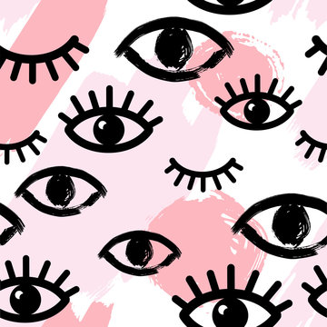 Abstract seamless pattern with pink hand drawn brush strokes and eyes