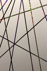 This is a photograph of a geometric design created using colourful tape applied onto a White paper