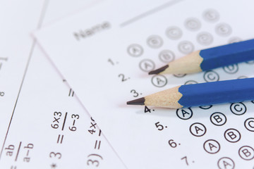 Pencil on answer sheets or Standardized test form with answers bubbled. multiple choice answer sheet © Achira22