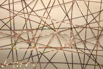 This is a photograph of a geometric design created using colorful tape applied onto a paper