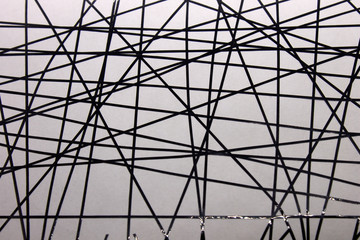 This is a photograph of a geometric design created using Black tape applied onto a White paper