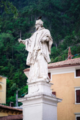 Fototapeta premium Cityscape with Religious sculpture in Arco town