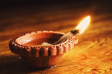 Diwali festival lamp on wooden background