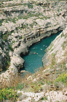 High angle view of people swimming in canyon river