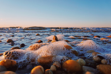 Eye level view of stones and sea foam