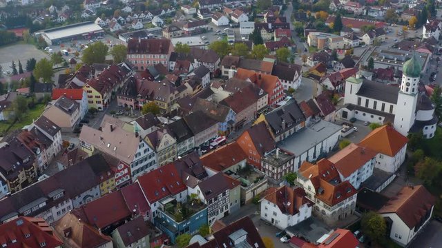 Aerial view of the city Stockach beside the lake Constance in Germany on a sunny day in autumn, fall. Pan to the left beside the old town.