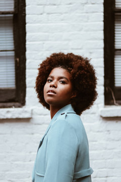 Portrait of young woman with afro hair style