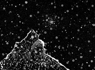 White dots forming pattern on black surface