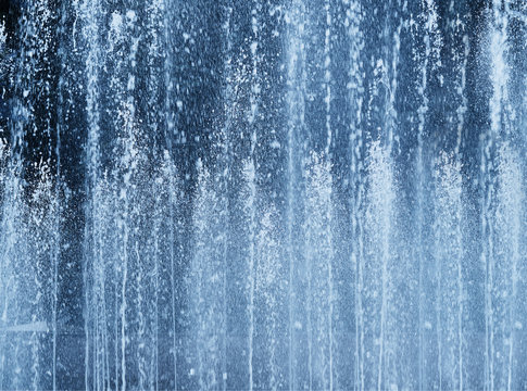 Vertical water fountain jet background © spacedrone808