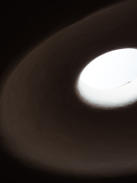 Low angle view of ceiling with hole