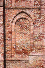 Texture of a gothic blind arch on the brick facade at the Zoutelande city church tower in the Netherlands