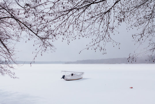 View of boat on frozen lake