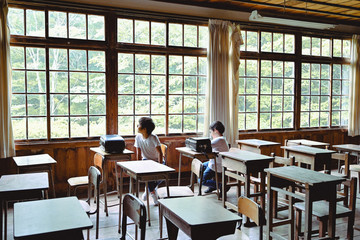 Students with school bags in classroom