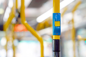 Yellow stop button for bus or tram. Press the button to request the bus driver for get off at the...
